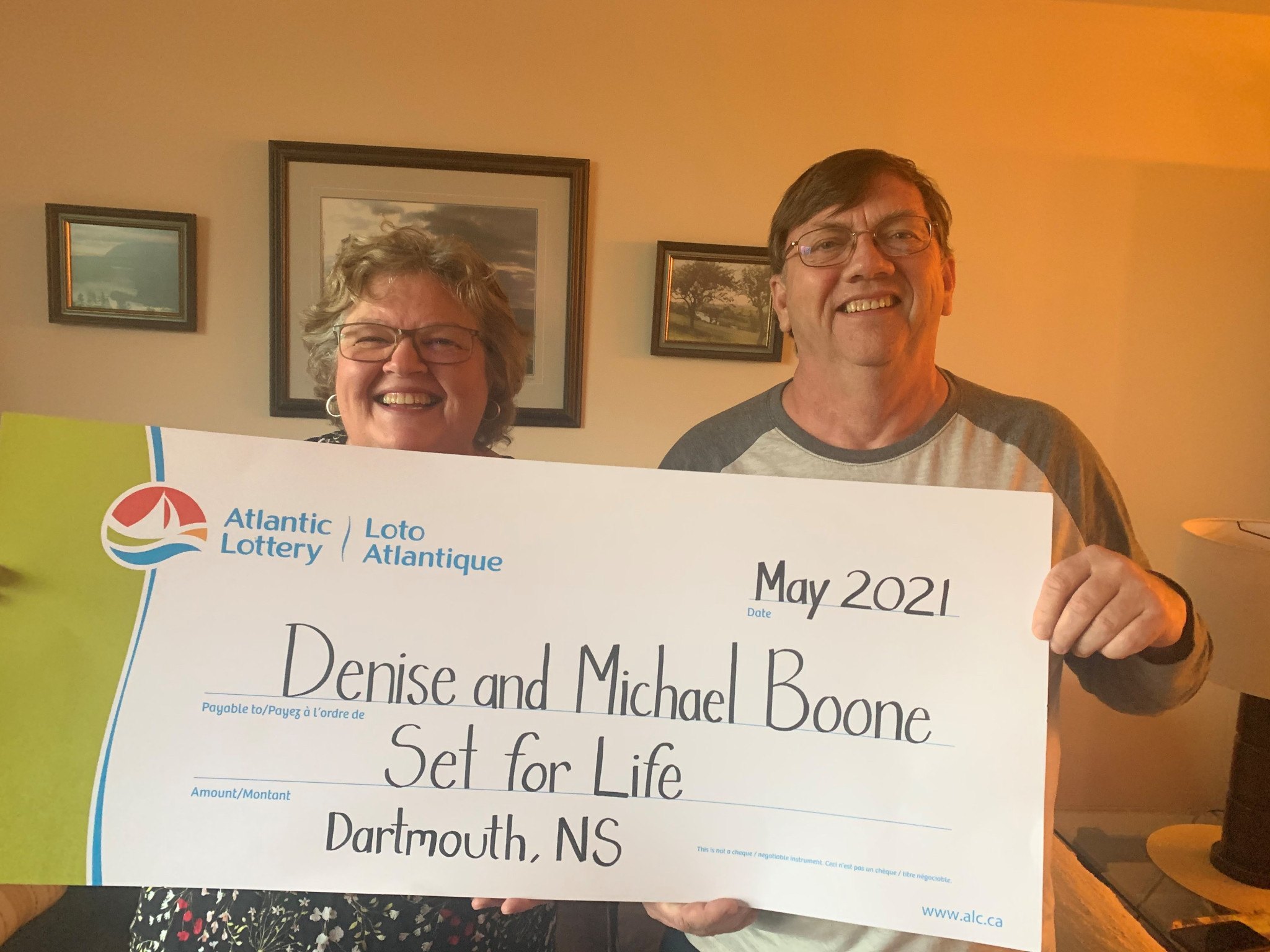 Denise and Michael Boone with their oversized winning prize check. Atlantic Lottery