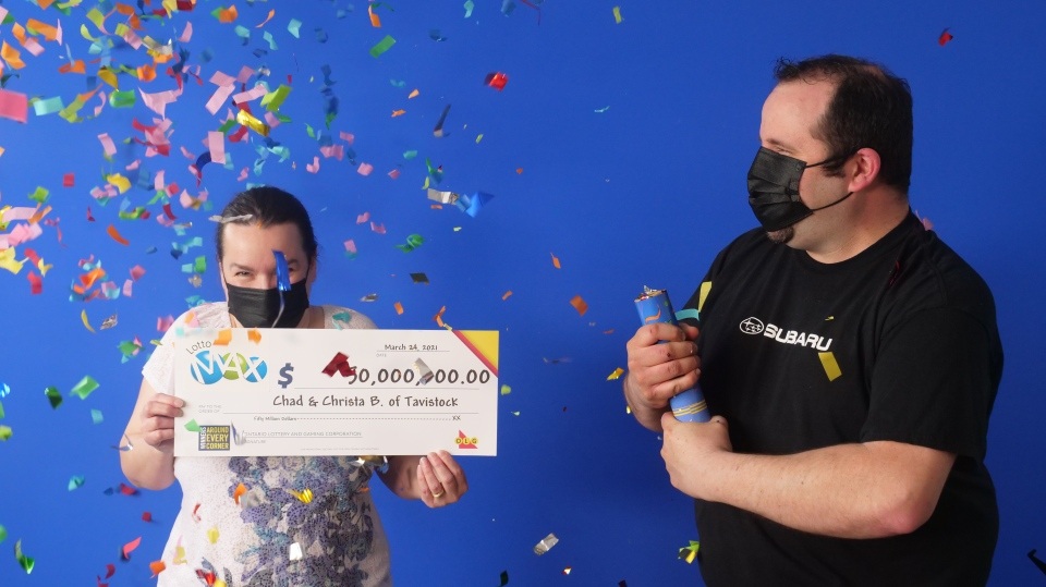 Chad and Christa Breyer of Tavistock, Ont. with their winning Lotto Max prize of $50 Million. (Photo: OLG)
