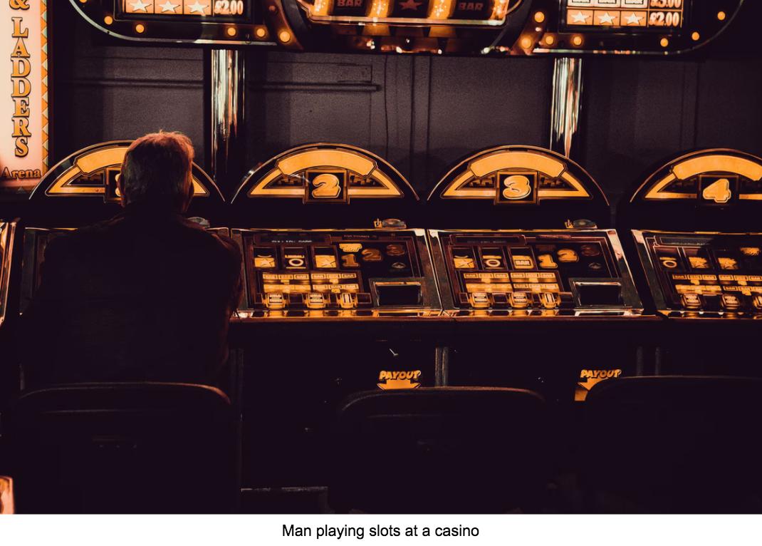 Man playing slots at casino